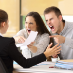 a couple arguing with a female employee