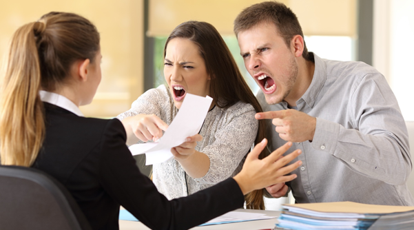 a couple arguing with a female employee
