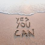 letters written in sand saying yes you can