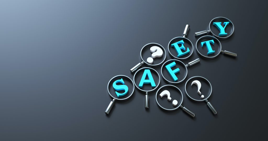 magnifying glasses showing the word safety in blue letter