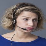 exasperated woman with telephone headset