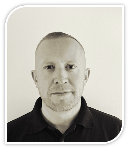 man with short hair and black polo shirt in sepia